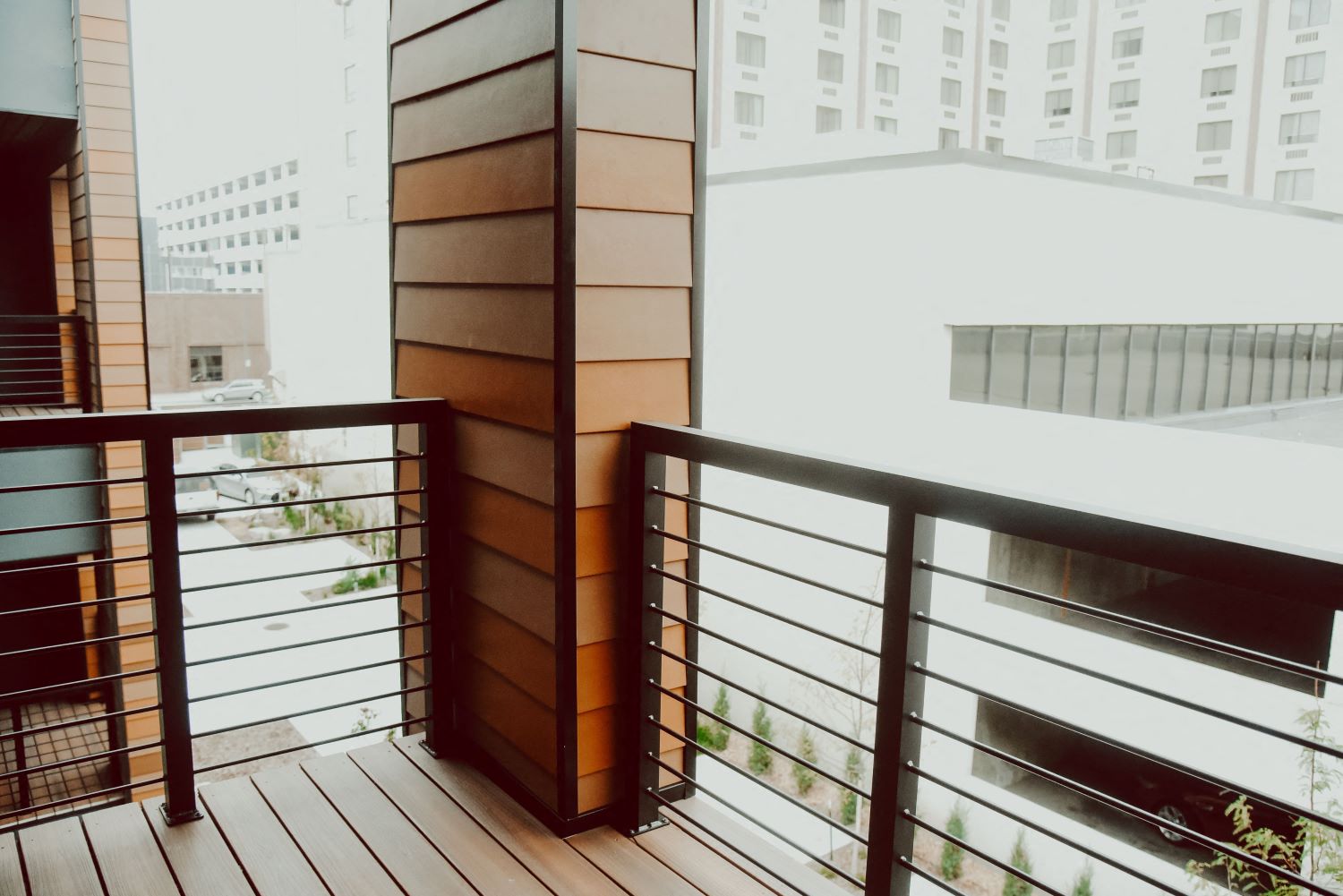 a balcony with a view of a city and a building