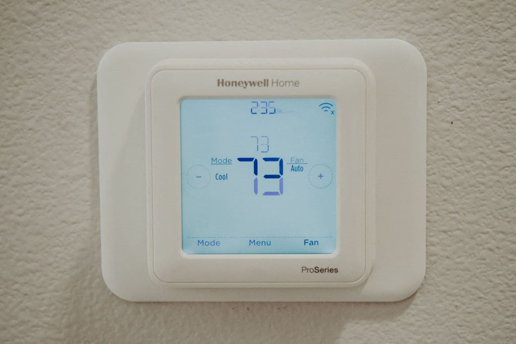 the thermostat on the wall is showing the temperature of the room