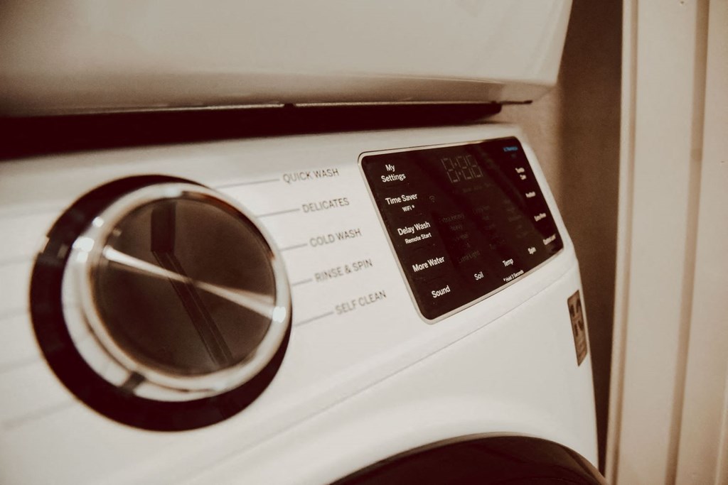 a white washing machine with the door open
