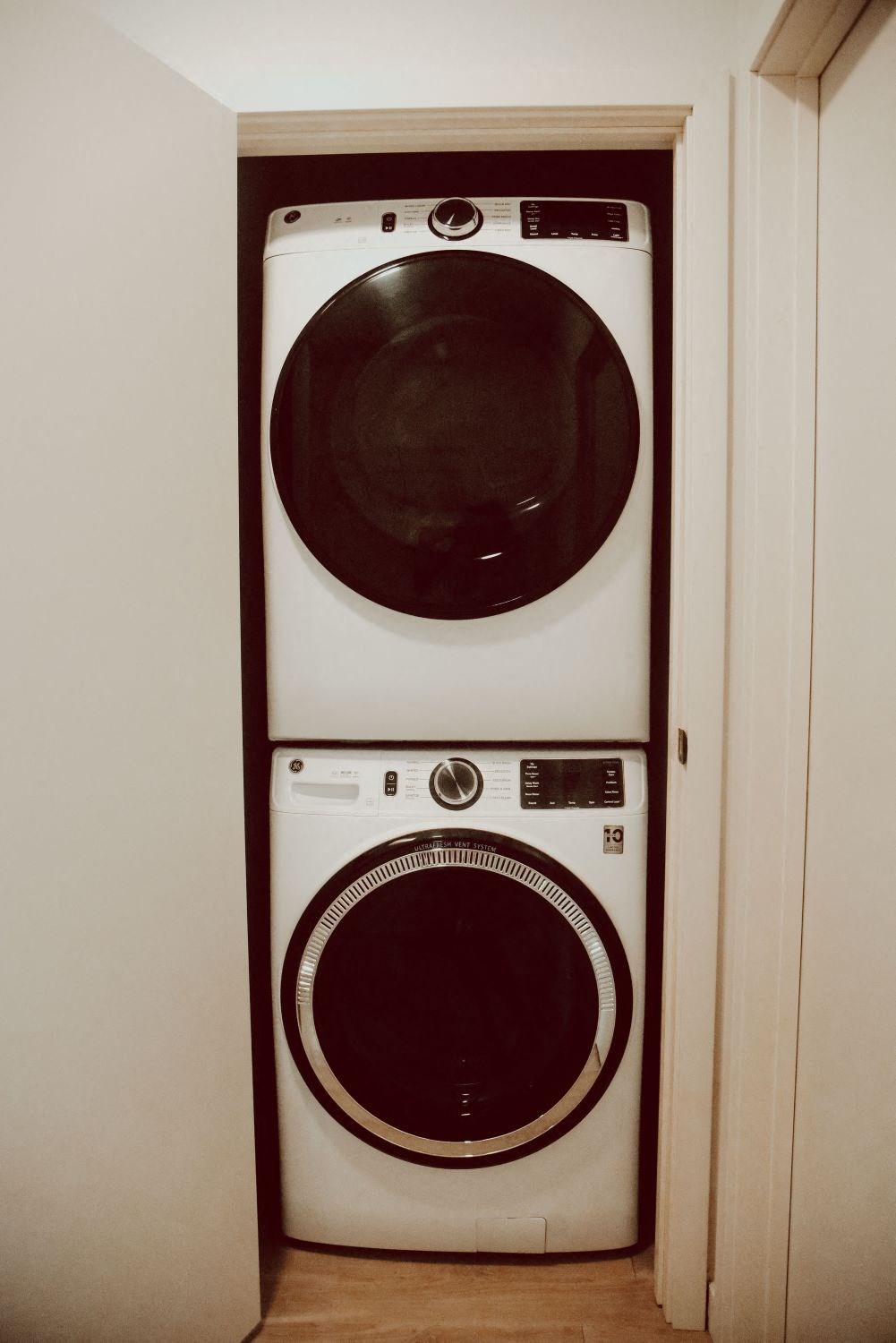 a washing machine and a dryer in a closet