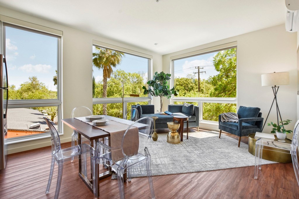 A sunny patio with a table and chairs.
