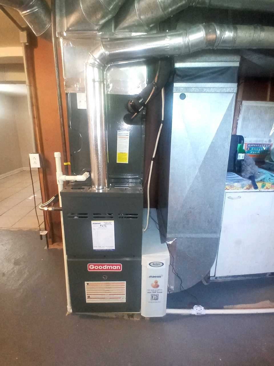 the new gas furnace is installed in the corner of the room
