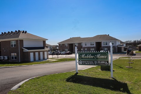 a welcome sign in front of a house