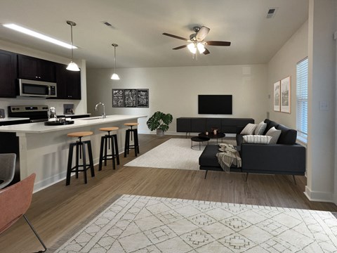 an open living room and kitchen with a couch and a bar