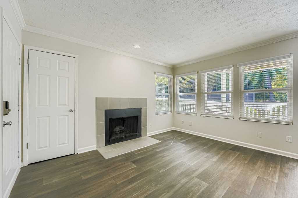 A room with a fireplace and a door.