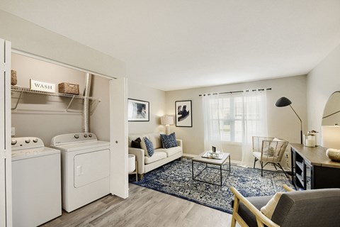 A laundry room with a washer and dryer is shown.
