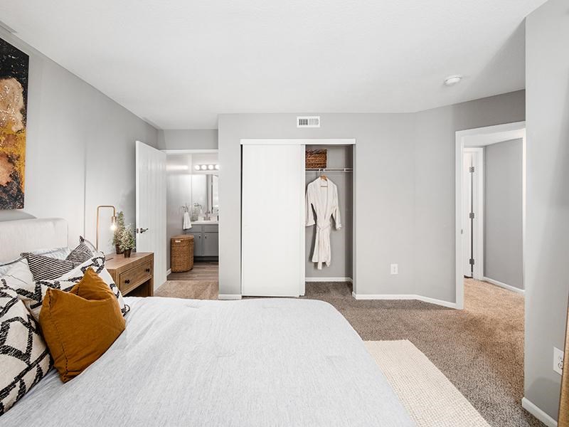 A bedroom with a large bed and a wardrobe.