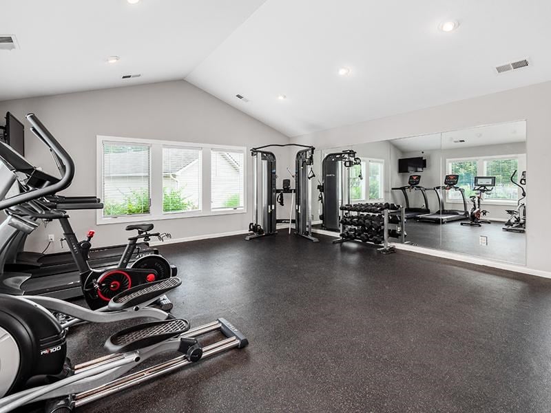 Fitness Center A spacious home gym with a variety of exercise equipment.