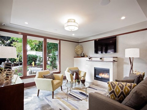 A living room with a fireplace and a couch.