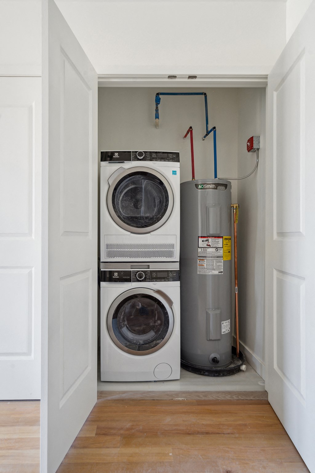 a small laundry room with a washer and dryer