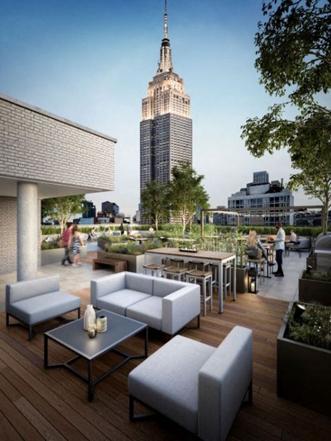 a rendering of the rooftop terrace with a view of the empire state building