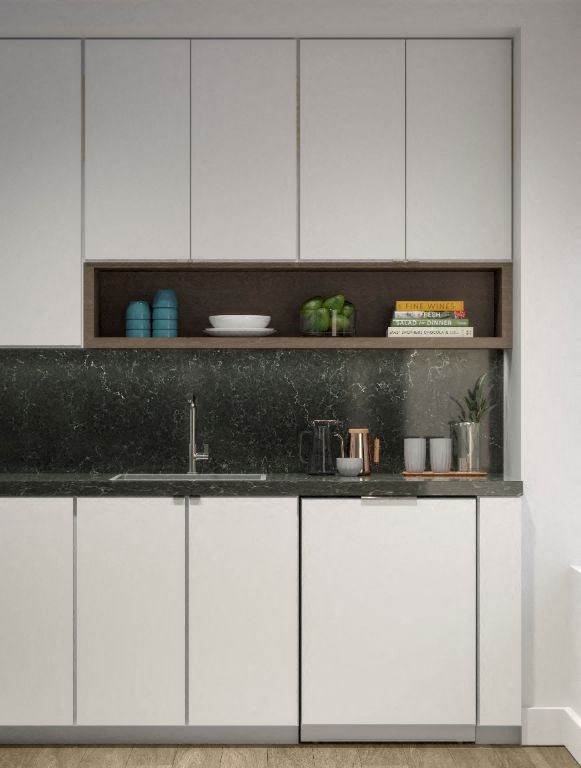a white kitchen with white cabinets and a black counter top