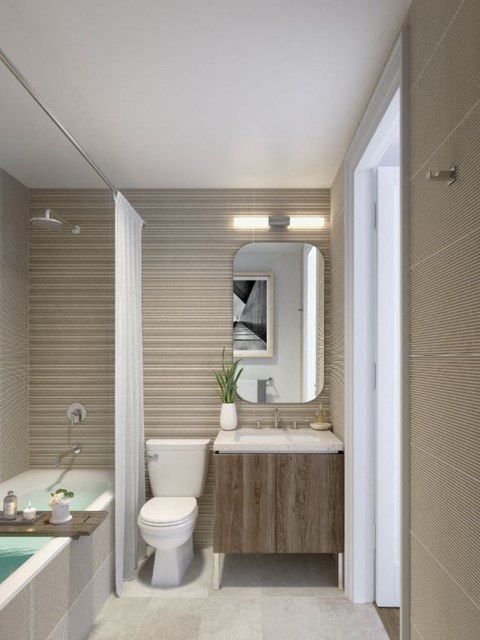 a bathroom with a toilet sink and a mirror