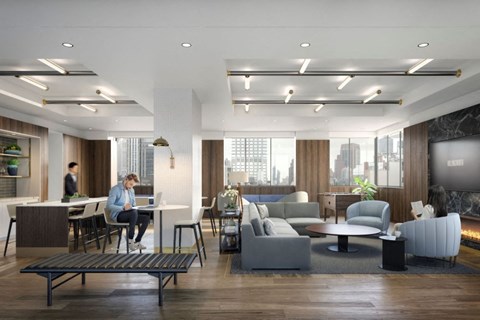 a rendering of a lobby with a person working on a laptop in a table