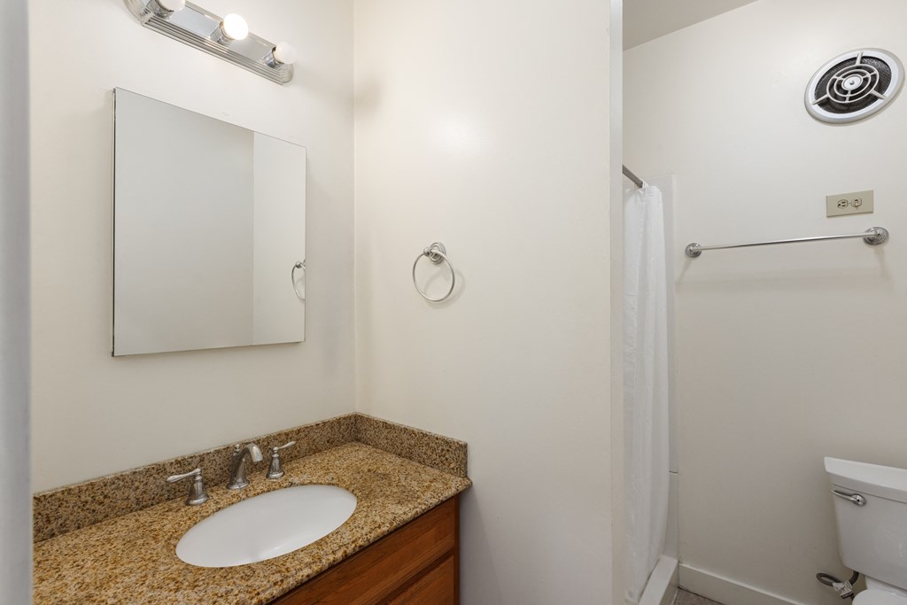 a bathroom with a sink and a shower