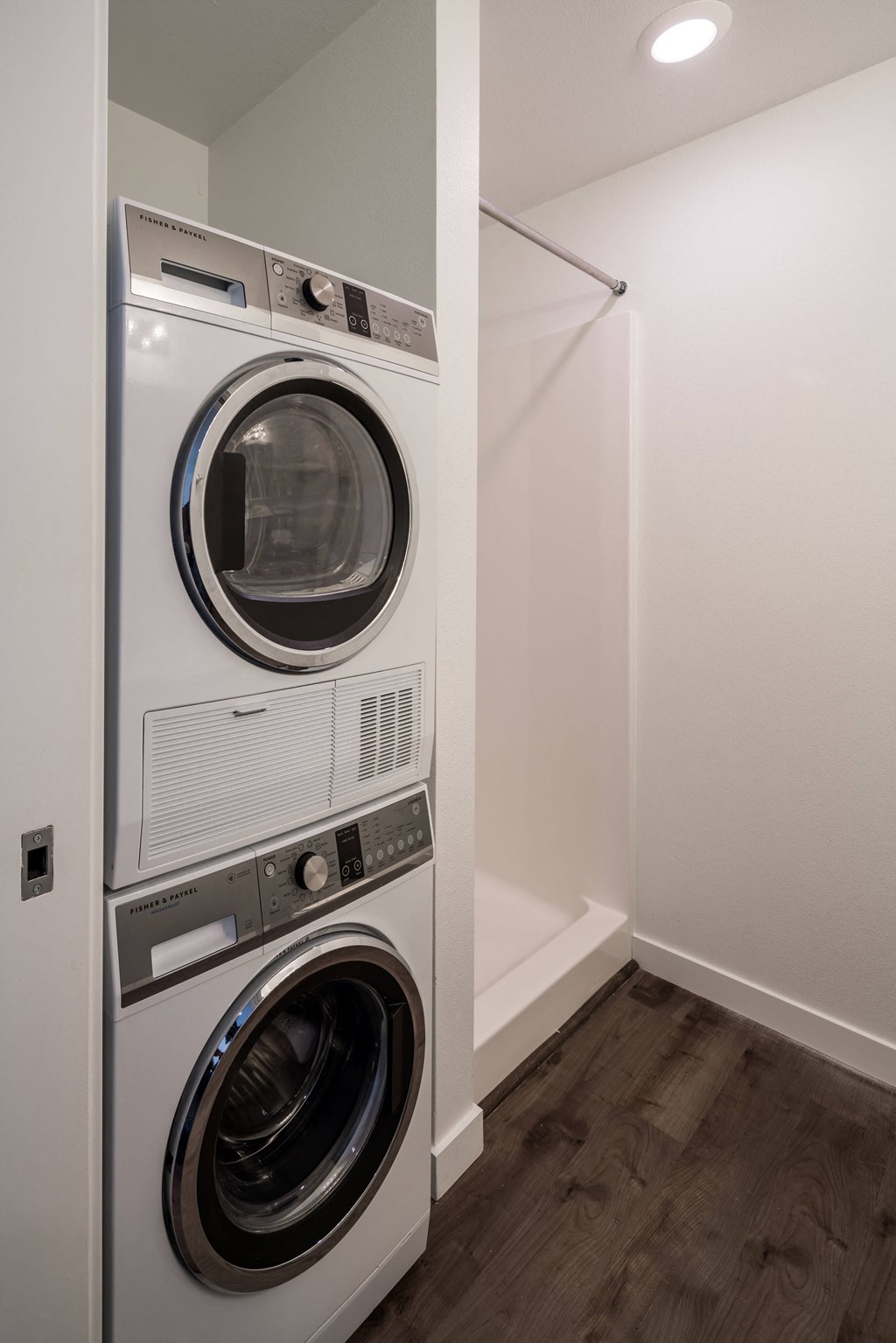 a front loading washer and dryer in a laundry room