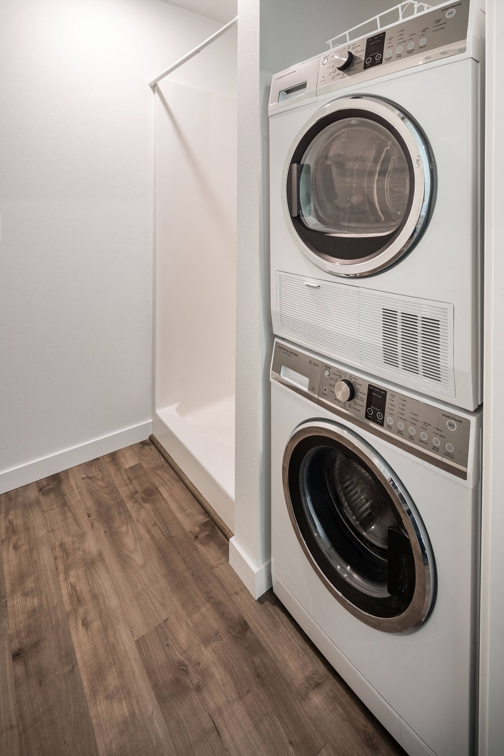 a front loading washer and dryer in a laundry room