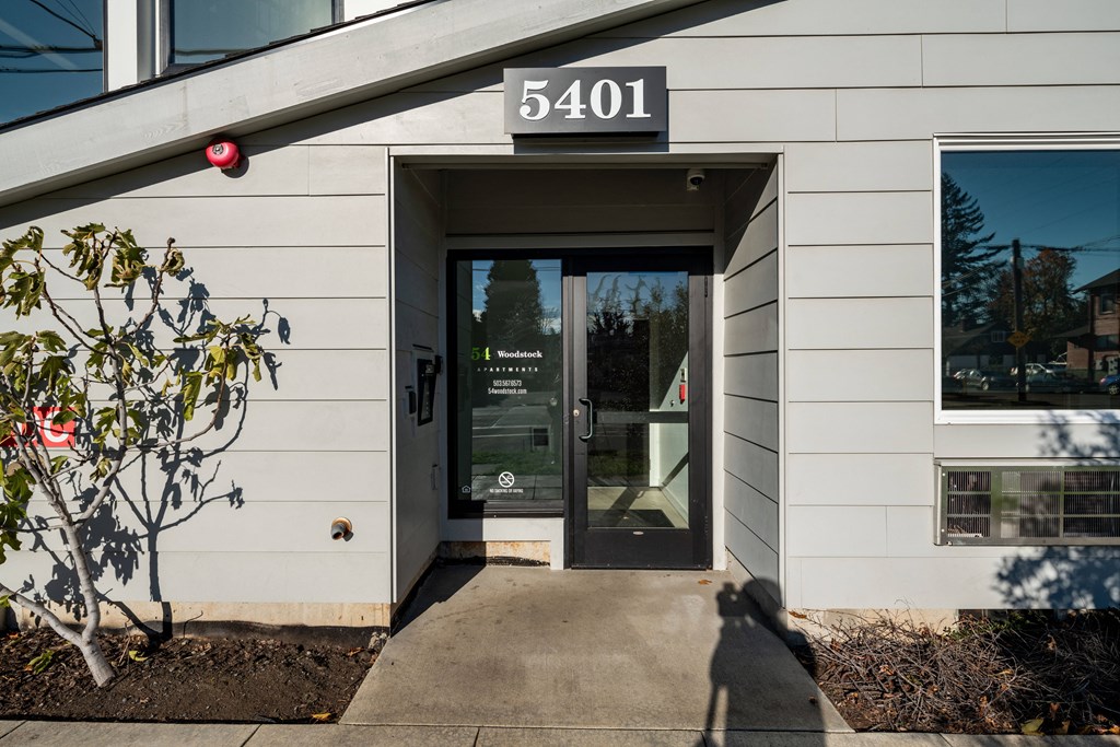 the front of a building with a glass door