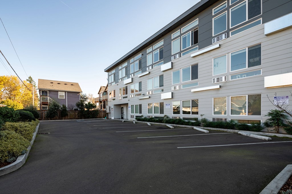 an empty parking lot in front of a building