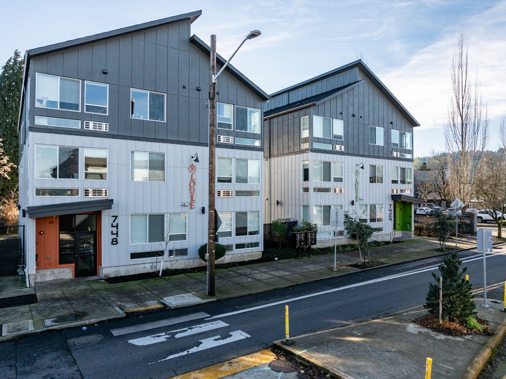 two buildings on the side of a street