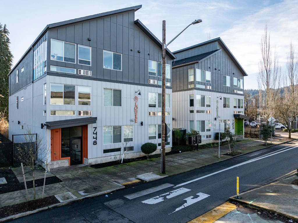 two buildings on the side of a street