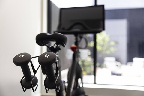 a group of headphones in front of a television at Analog PDX Apartments, Portland