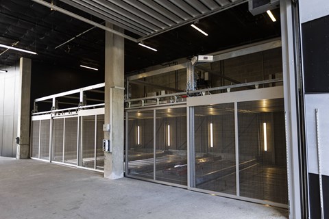the inside of a large building with a large glass door at Analog PDX, Oregon