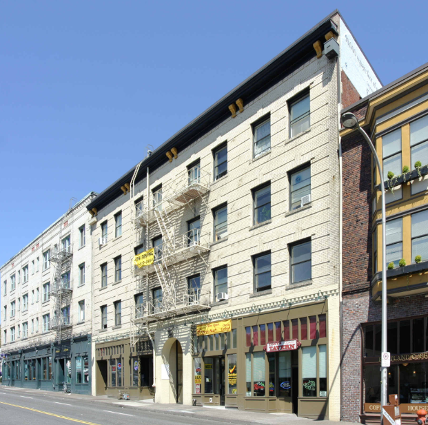 a building on the corner of a city street