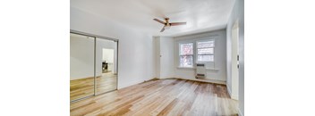 A room with a ceiling fan and a window at Clay & Tiffany, Portland, 97201