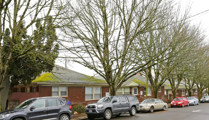a house with cars parked in front of it