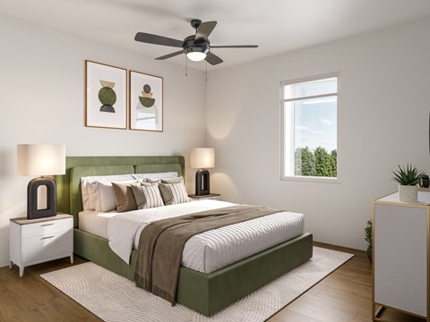 A bedroom with a large bed and a ceiling fan.