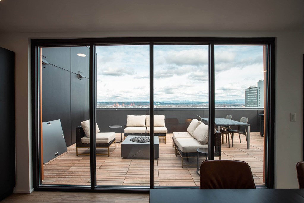 a balcony with a city view and a table and chairs at Analog Tacoma, Tacoma, WA