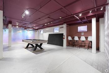 a room with a pool table and a chalkboard in the middle at Clay & Tiffany, Portland, 97201