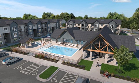 A large building with a pool in front of it.