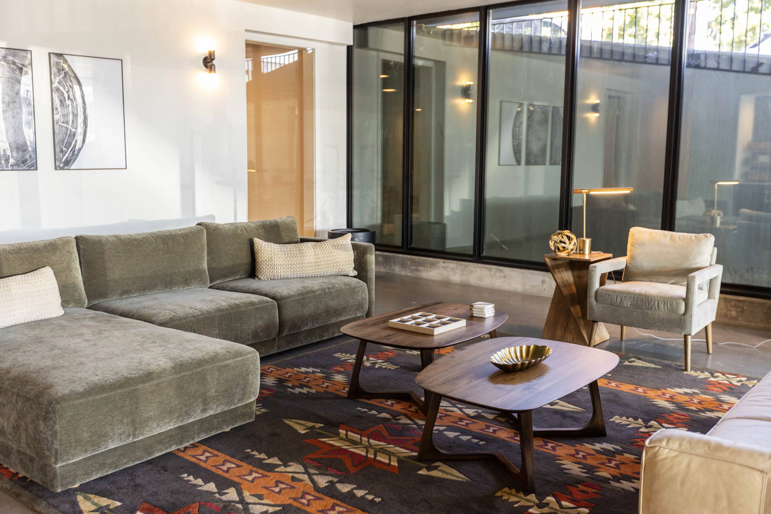 a living room with couches and a coffee table