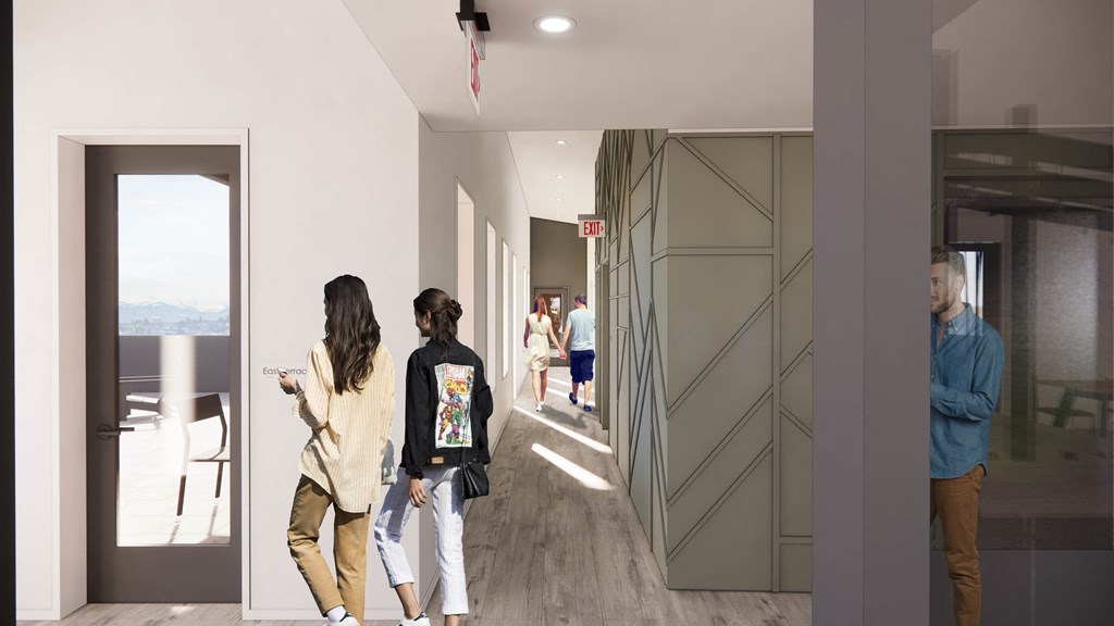 a group of people walking down a hallway in a building at Moraine, Tacoma, 98402
