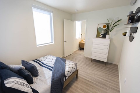 a bedroom with a bed and a dresser in a room at Moraine, Washington 98402