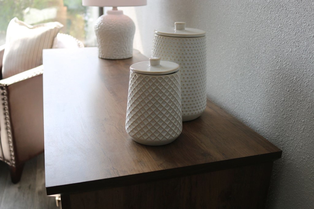 a wooden table with jars and vases on it at Schaefer Ridge Apartments, Missouri
