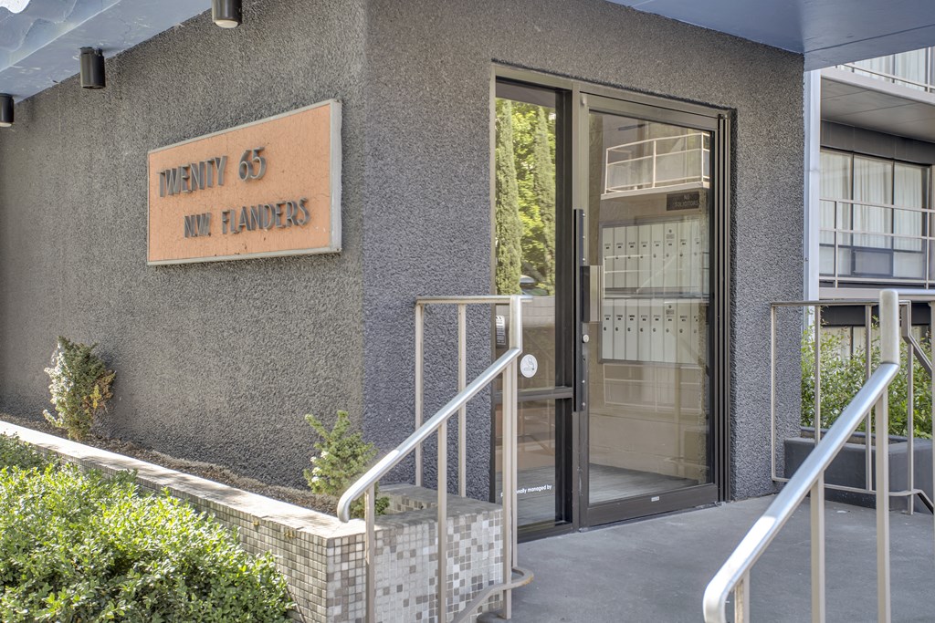 a building with a glass door and a sign that reads health 66 on farmers