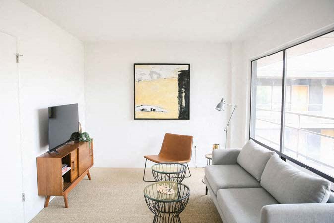 a living room with a couch and a television