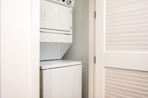 A white dishwasher is installed in a kitchen.