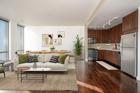 A modern living room with a white couch and a coffee table.