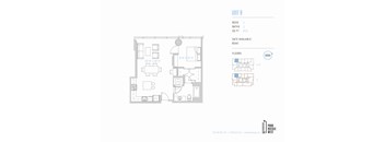 A floor plan for a unit with a kitchen, living room, and two bedrooms.