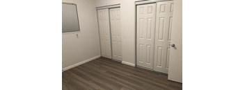 a room with three doors and a window