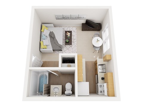 A small white room with a bed, a toilet, a sink, and a small table.