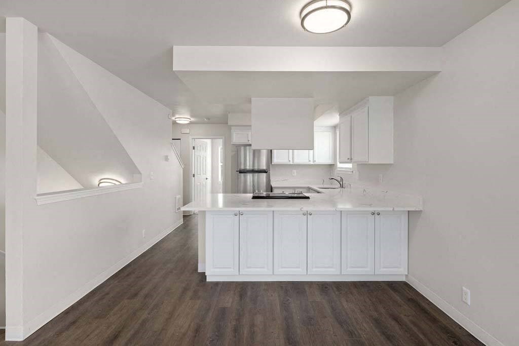 a kitchen with a counter top and a sink
