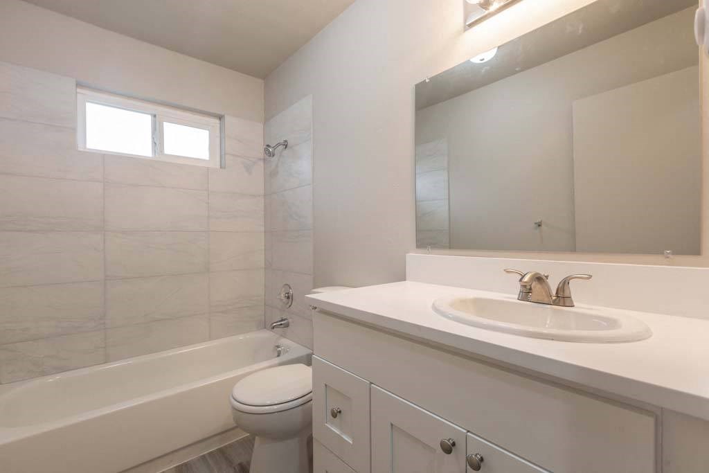a bathroom with a sink toilet and bathtub