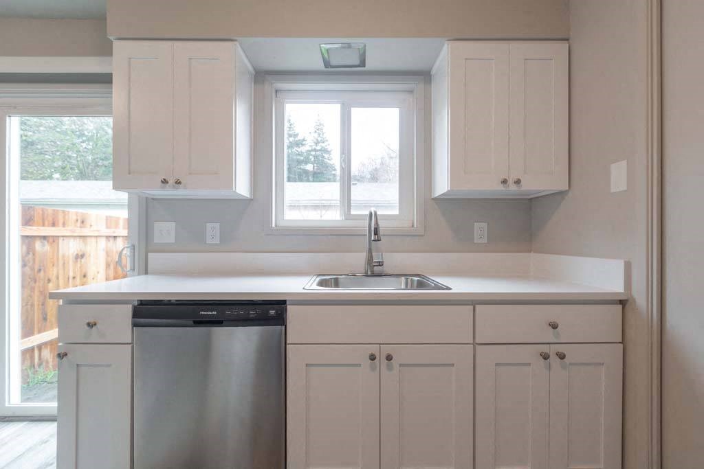 a kitchen with a sink and a window