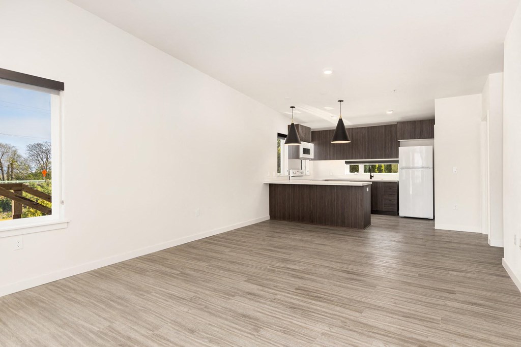 the living room and kitchen in a 555 waverly unit