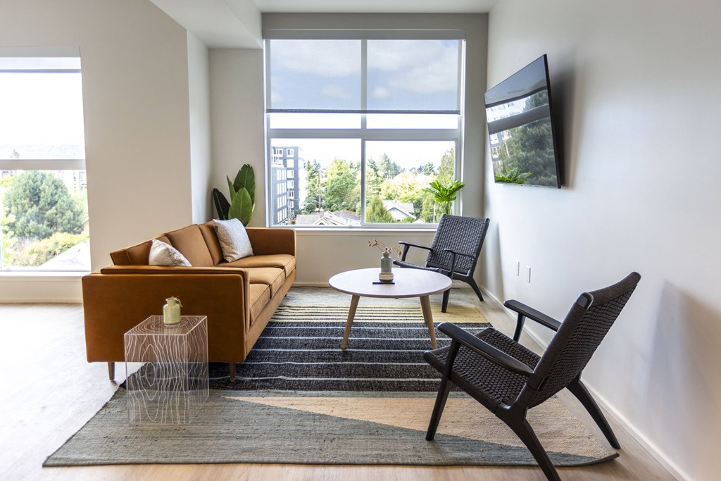 a living room with a couch and two chairs and a table at Shift, Portland, OR 97217